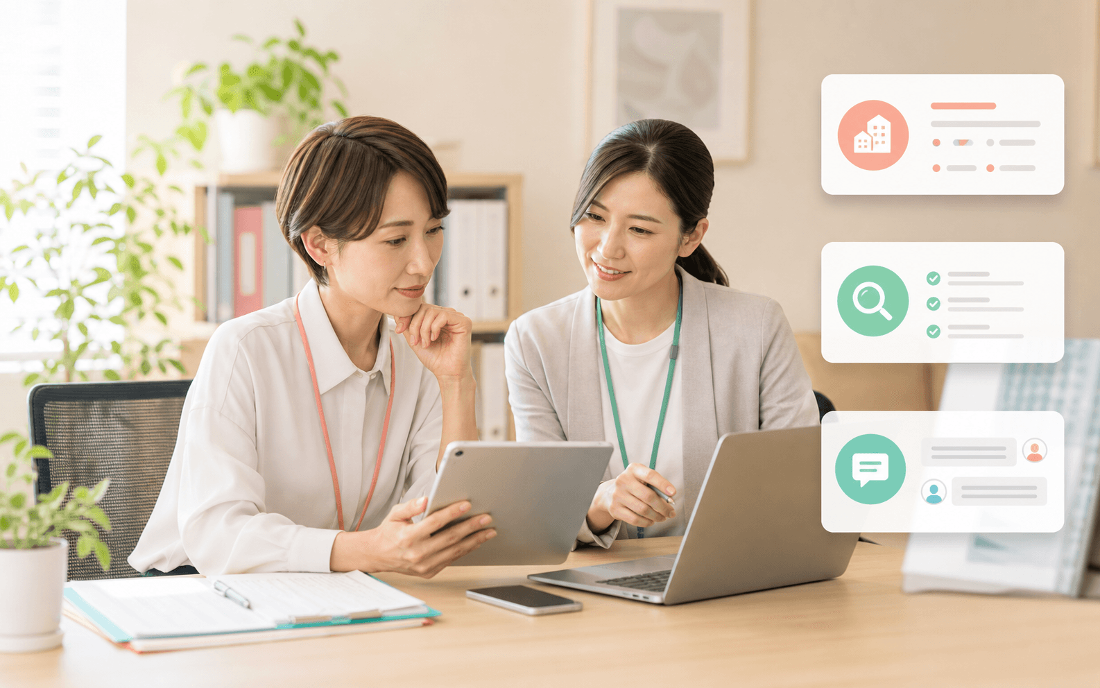 ケアマネジャーがタブレットを見ながら情報を確認している様子